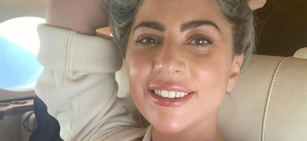 Lady Gaga smiles from a plane