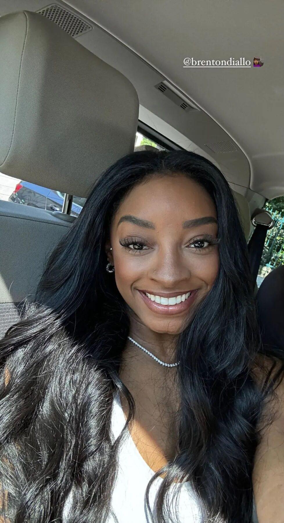 Simone Biles takes a selfie showing off new hairstyle