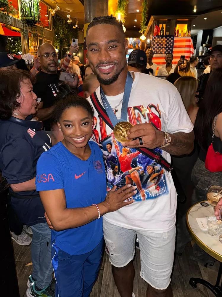 Simone Biles and Jonathan Owens celebrating Team USA Gold win