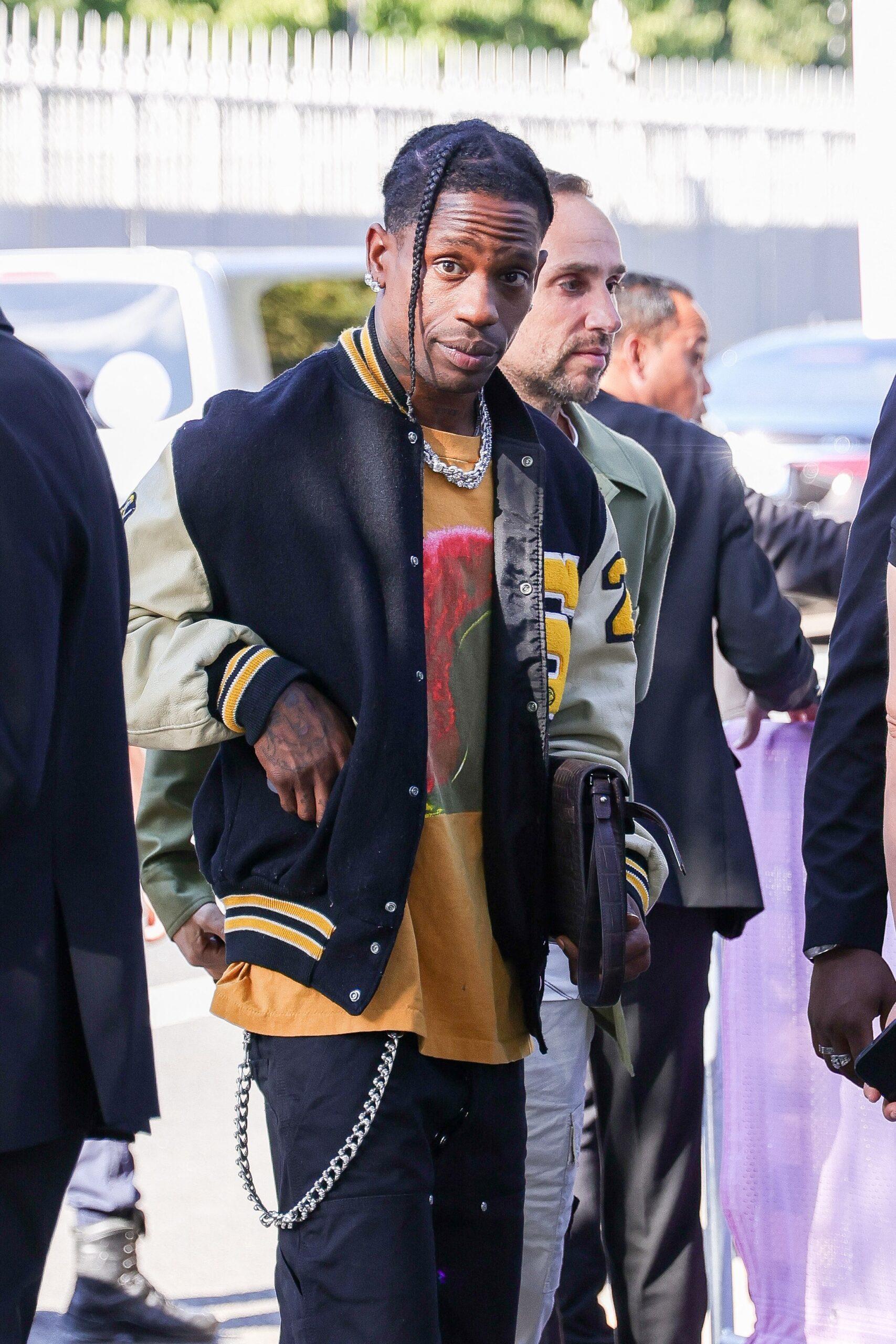 Travis Scott arrives with a unidentified woman at the Paris 2024 Olympic basketball semi-final