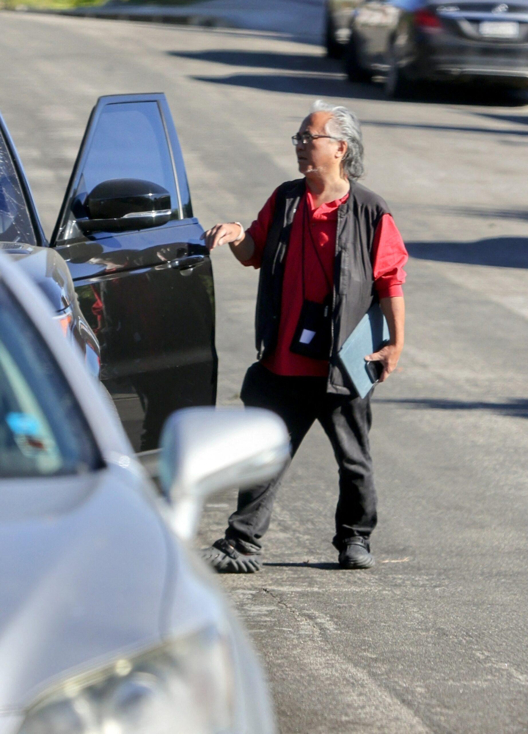 Matthew Perry's longtime assistant Kenny Iwamasa spotted at his $6 million LA mansion for the FIRST time since tragic actor was found dead, amid reports HE may have discovered the body.