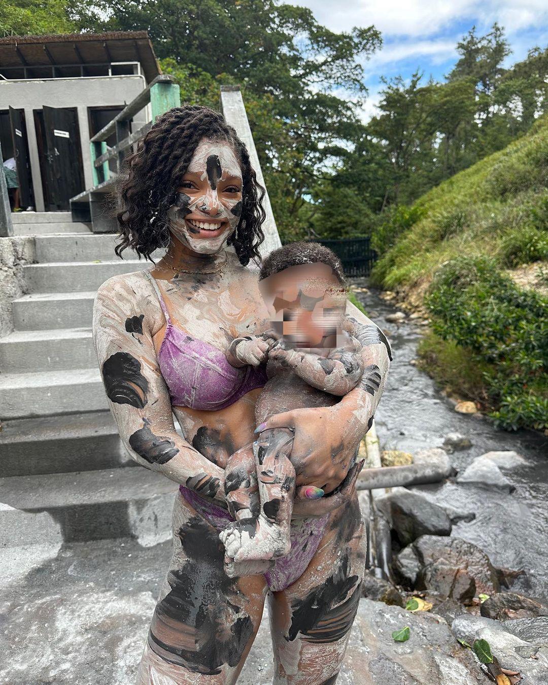 Halle Bailey and her son covered in clay