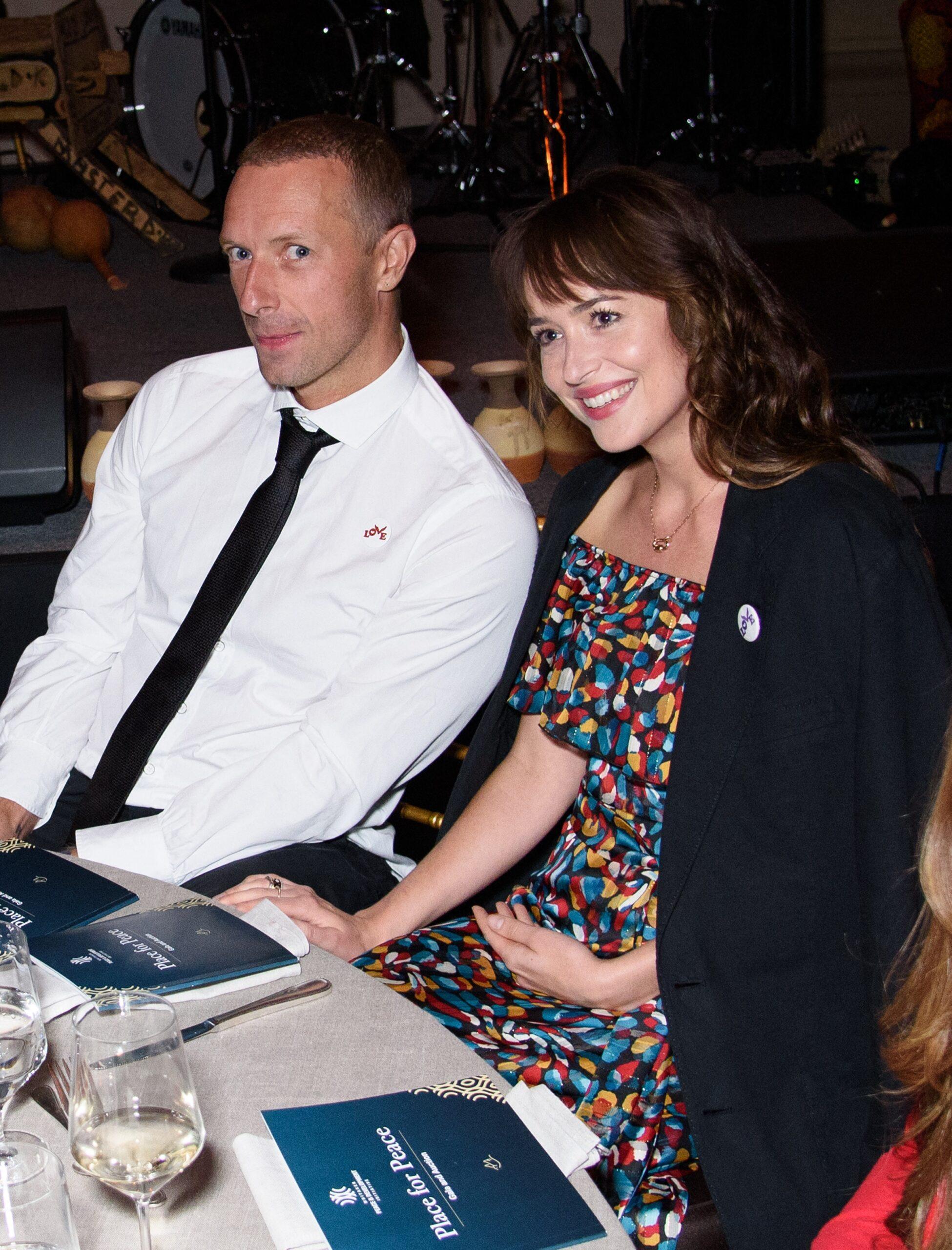 Chris Martin and Dakota Johnson Attend "Place for Peace" Event