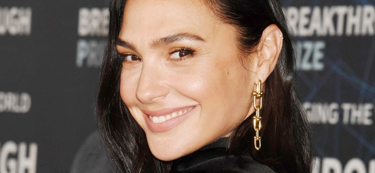 Gal Gadot smiles at a premiere