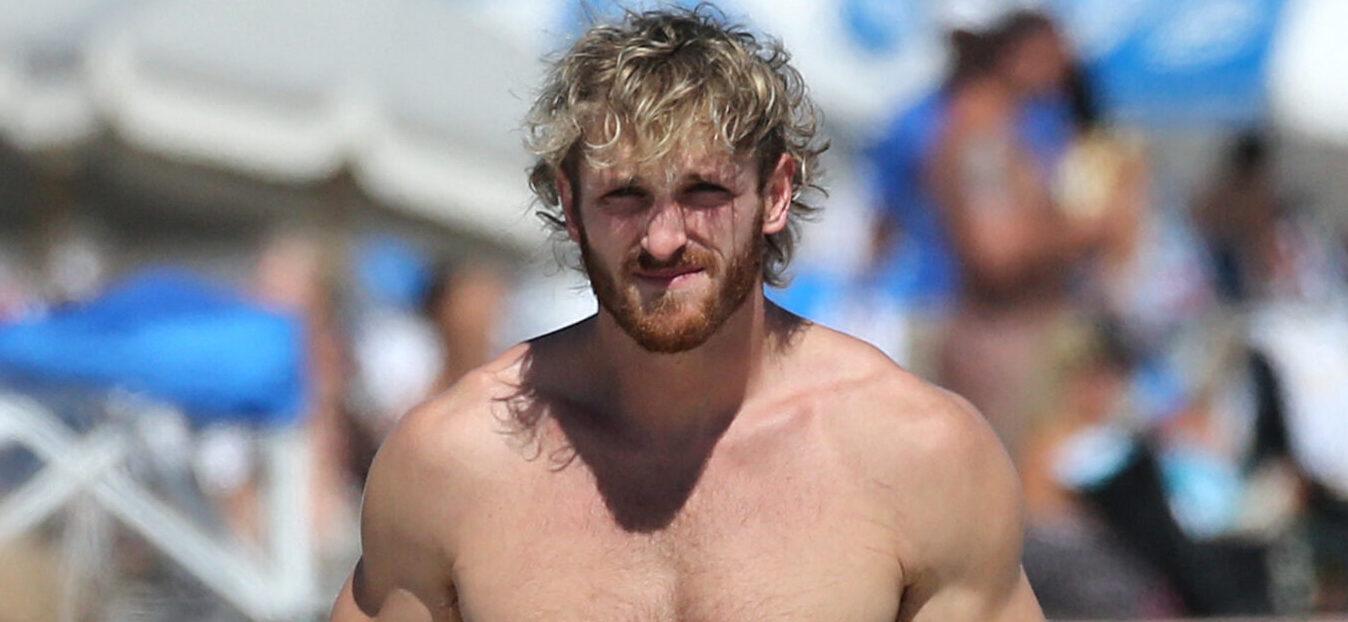 Logan Paul shows off his muscular physique as he hits the beach with bikini-clad girlfriend Nina Agdal in Miami. 23 Oct 2022 Pictured: Logan Paul; Nina Agdal. Photo credit: MEGA TheMegaAgency.com +1 888 505 6342 (Mega Agency TagID: MEGA910542_002.jpg) [Photo via Mega Agency]