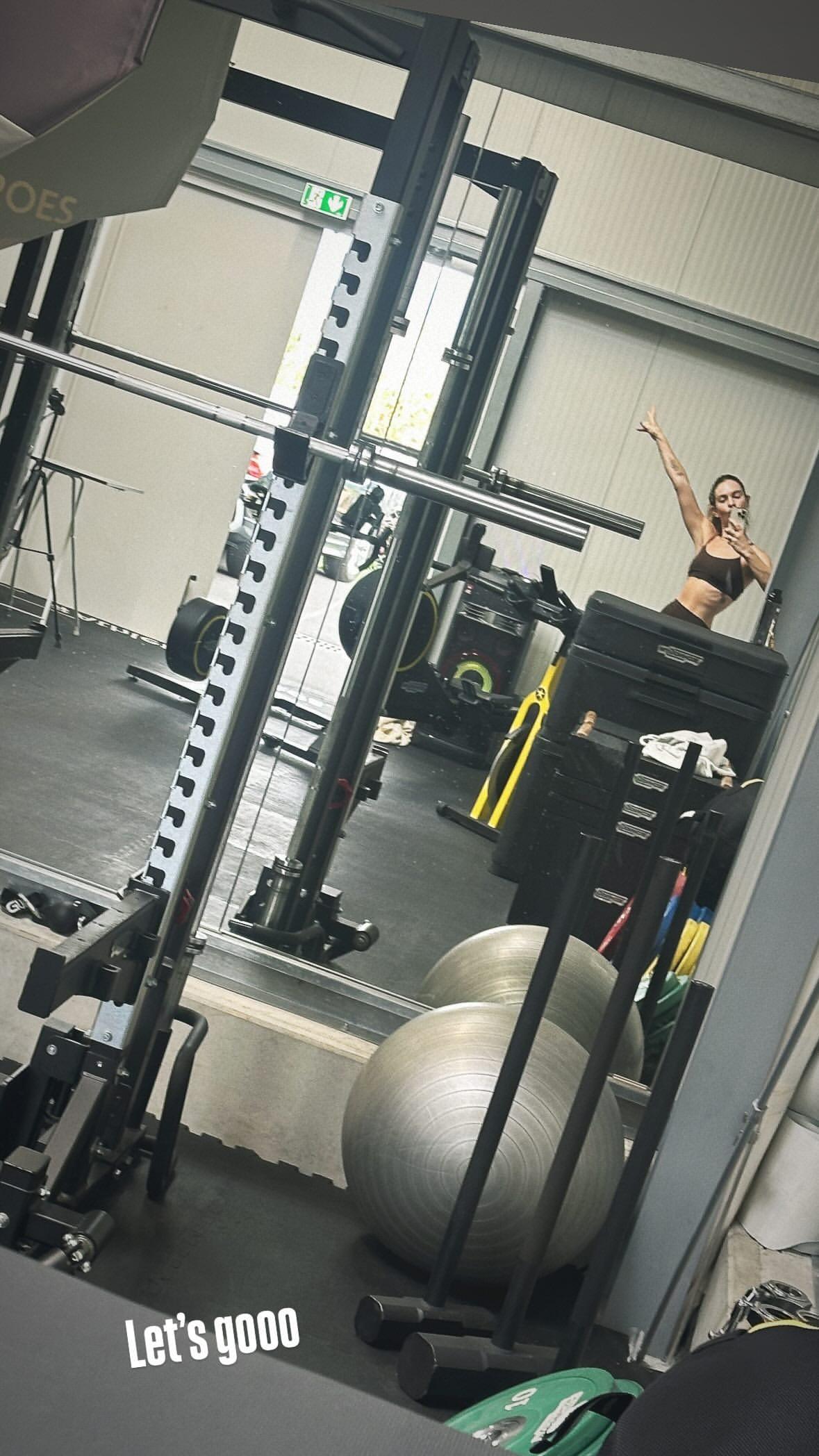 Lily James snaps a selfie while at the gym.