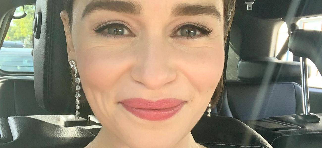 Emilia Clarke poses smiling