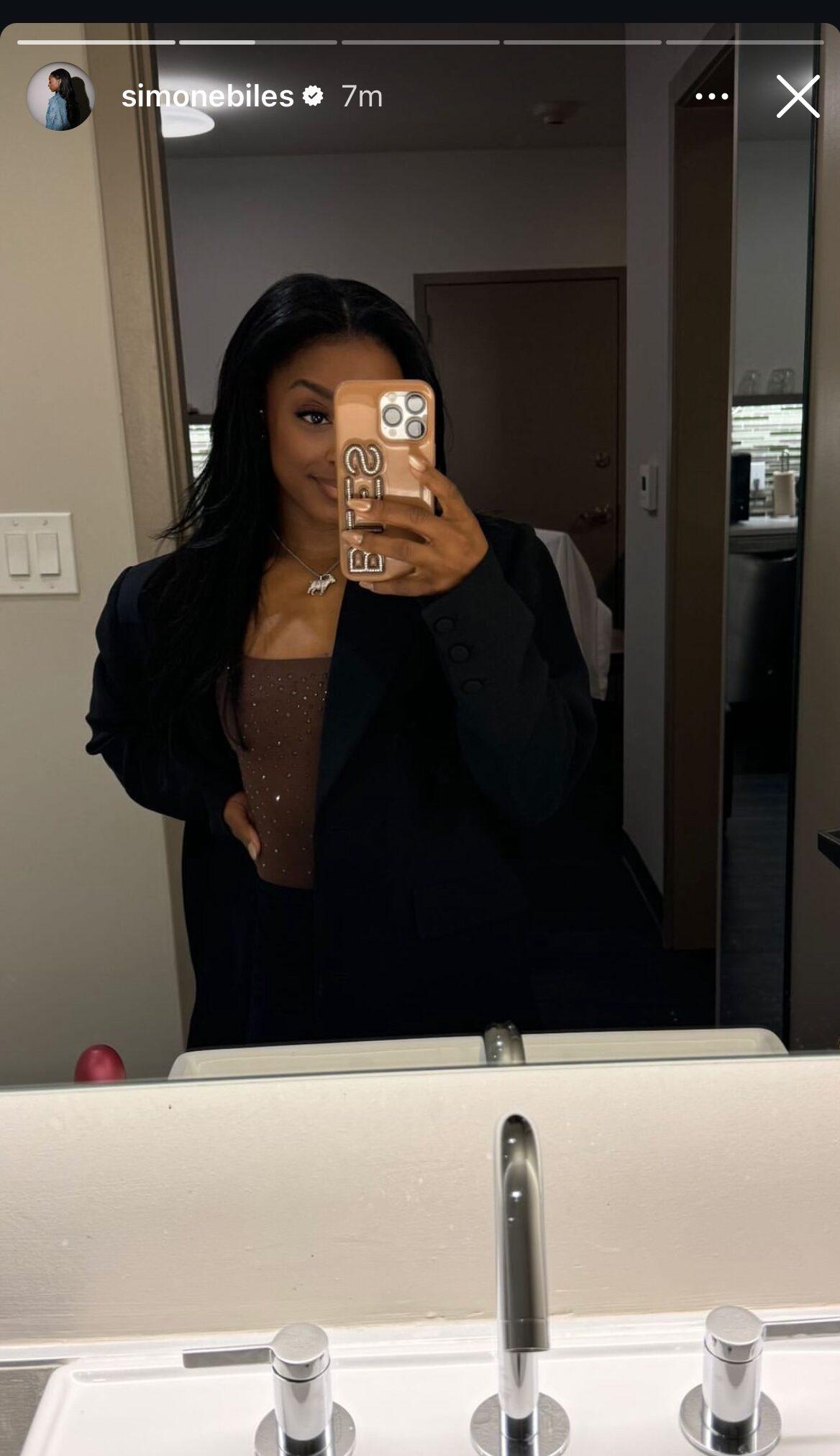 Simone Biles taking a mirror selfie