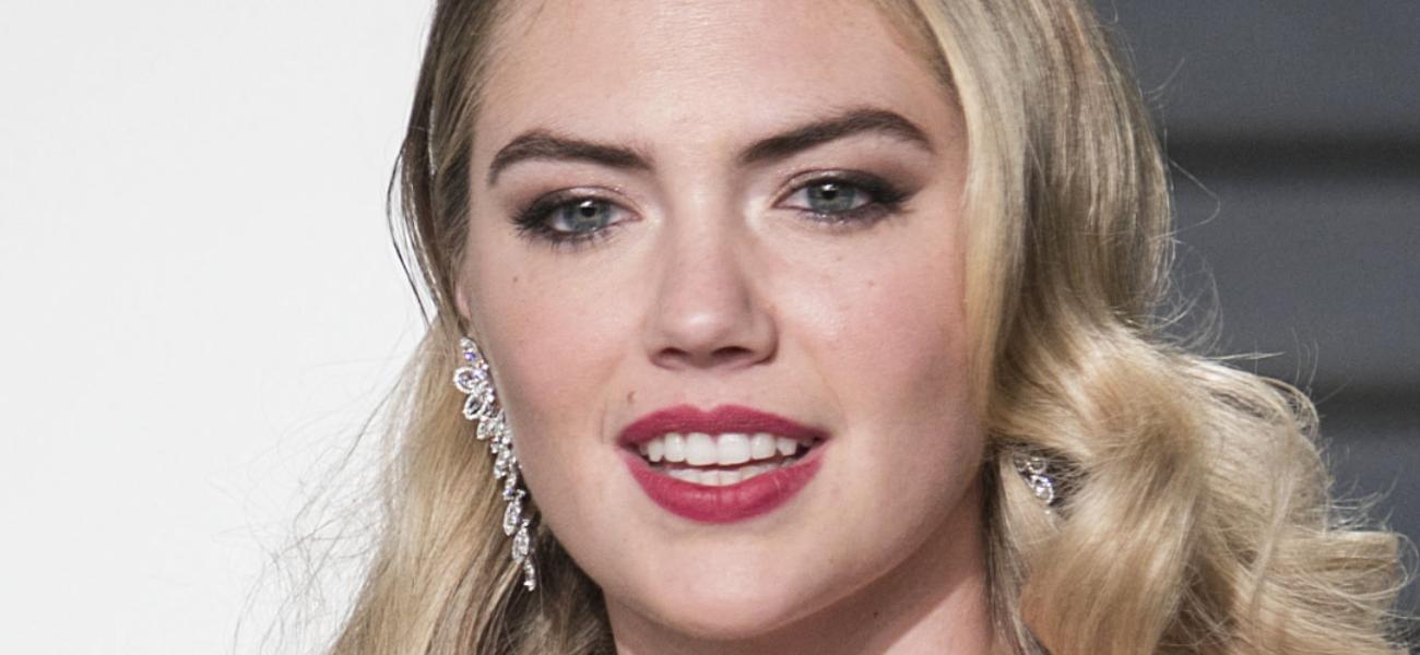 Kate Upton smiles at an event