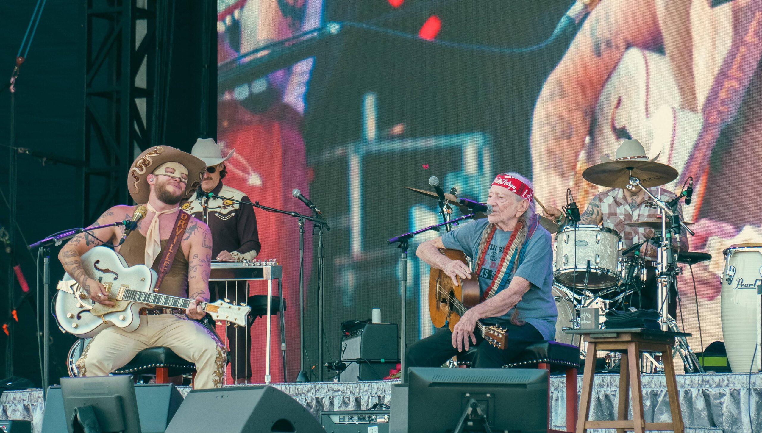 Orville Peck and Willie Nelson on stage