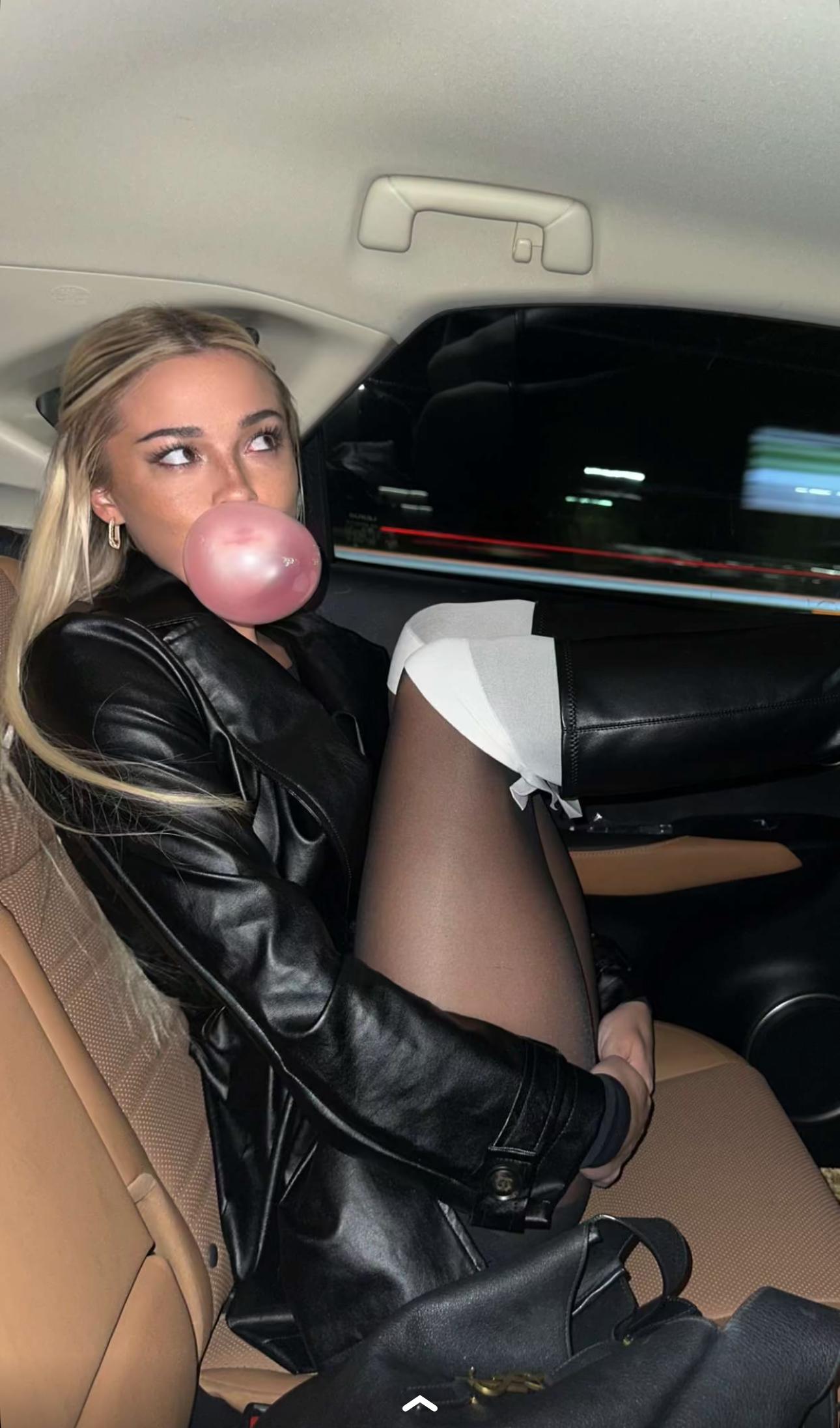 Olivia Dunne strikes a pose in the car.