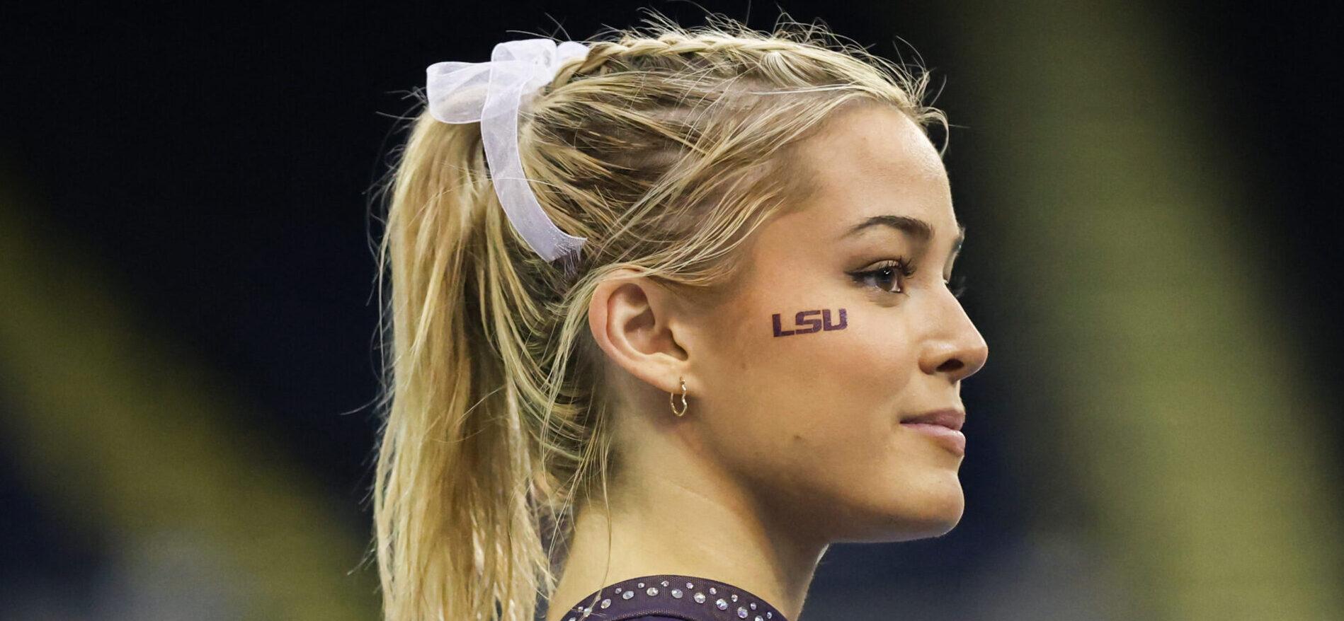 March 8, 2024: LSU's Olivia Dunne watches as her teammates warm up on the floor during the Purple and Gold Podium Challenge woman's gymnastics quad meet at the Raising Canes River Center in Baton Rouge, LA. Jonathan Mailhes/CSM (Credit Image: © Jonathan Mailhes/Cal Sport Media) Newscom/(Mega Agency TagID: csmphotothree239119.jpg) [Photo via Mega Agency]