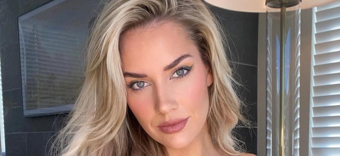 Paige Spiranac poses for the camera.