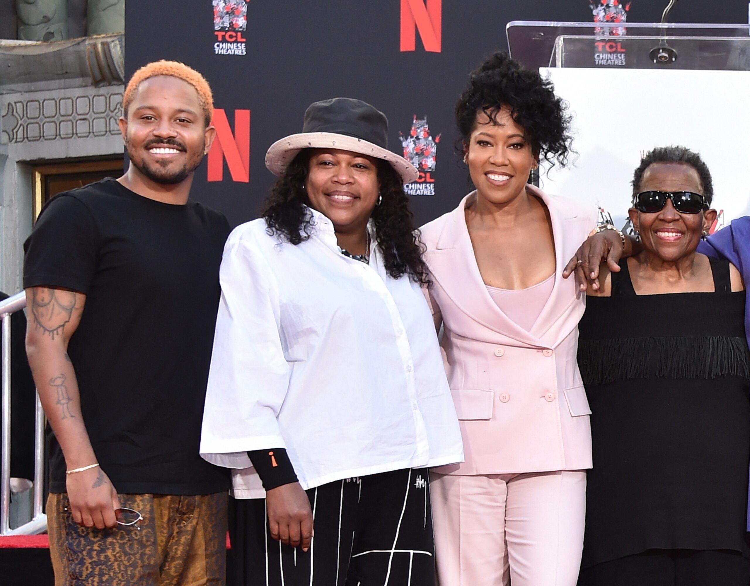 Regina King with Ian Alexander Jr. and family at CL Chinese Theatre on October 28, 2021 in Hollywood, CA