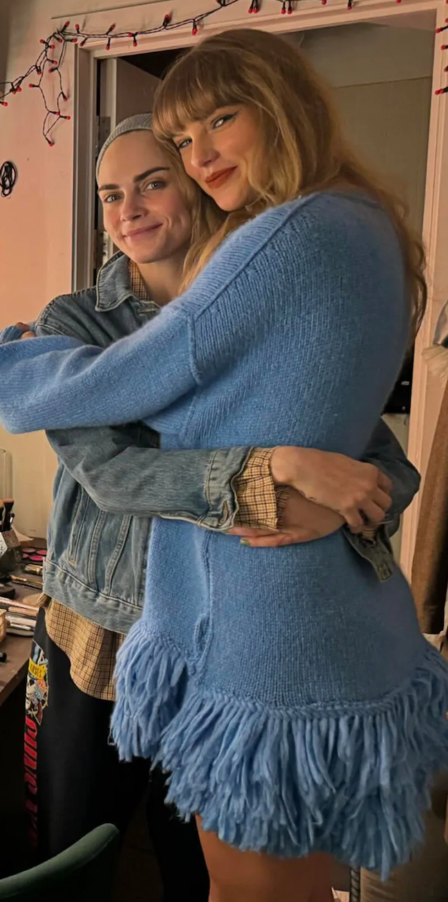 Cara Delevingne hugging Taylor Swift