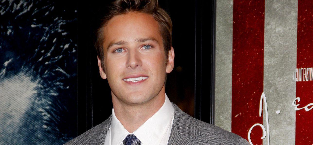 Armie Hammer poses