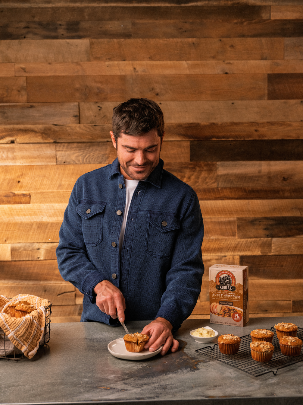 Zac Efron cutting a muffin