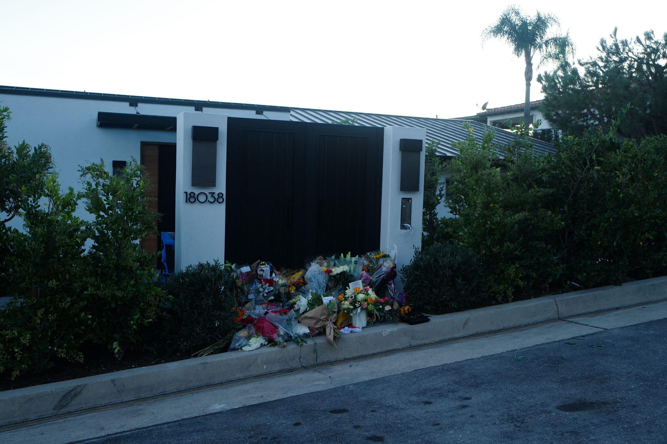 Floral tributes continue to be laid outside of the home of Friends star Matthew Perry