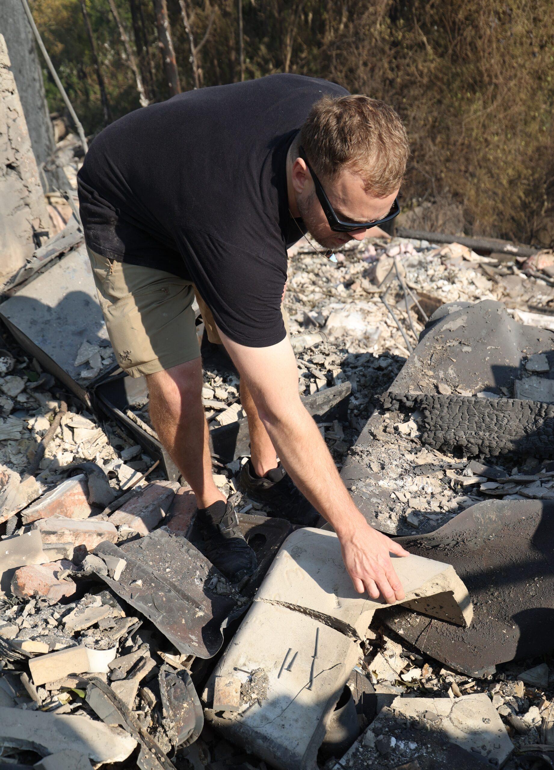 PREMIUM EXCLUSIVE: Spencer Pratt seen at his home which burned down trying to salvage crystals and any personal items in the devastating aftermath of his family loss