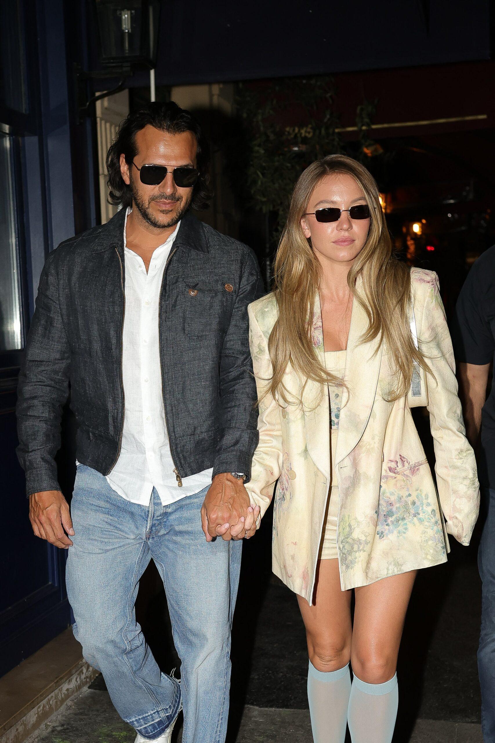 Sydney Sweeney and Jonathan Davino hand in hand after a romantic dinner in an Italian restaurant in Paris