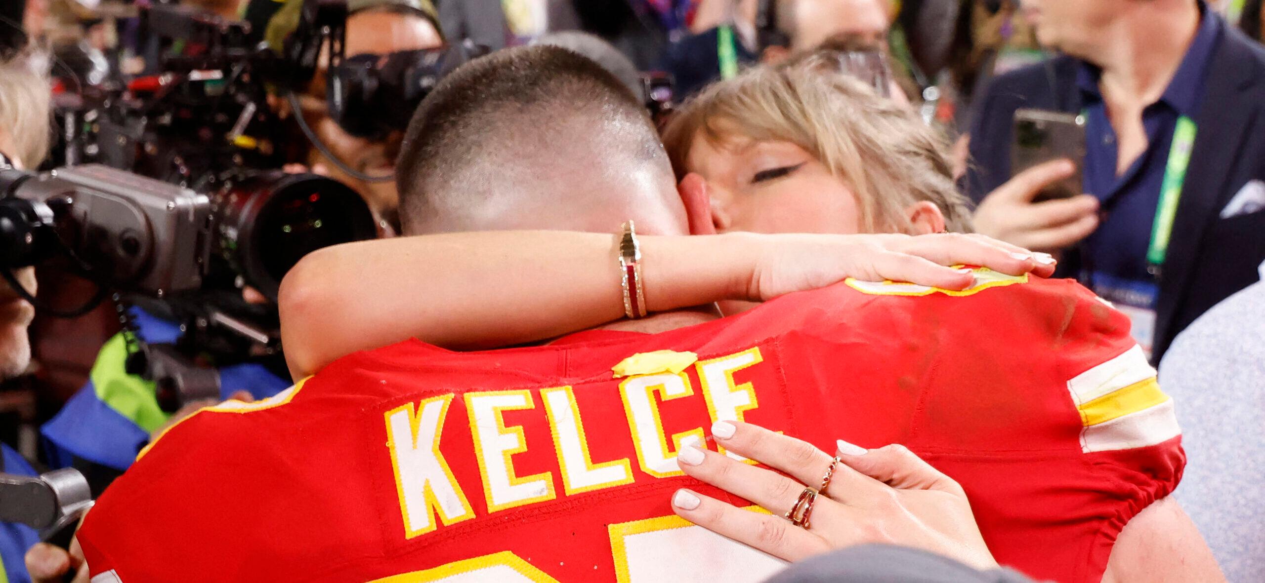 Taylor Swift embraces beau Travis Kelce after the Kansas City Chiefs win the super bowl