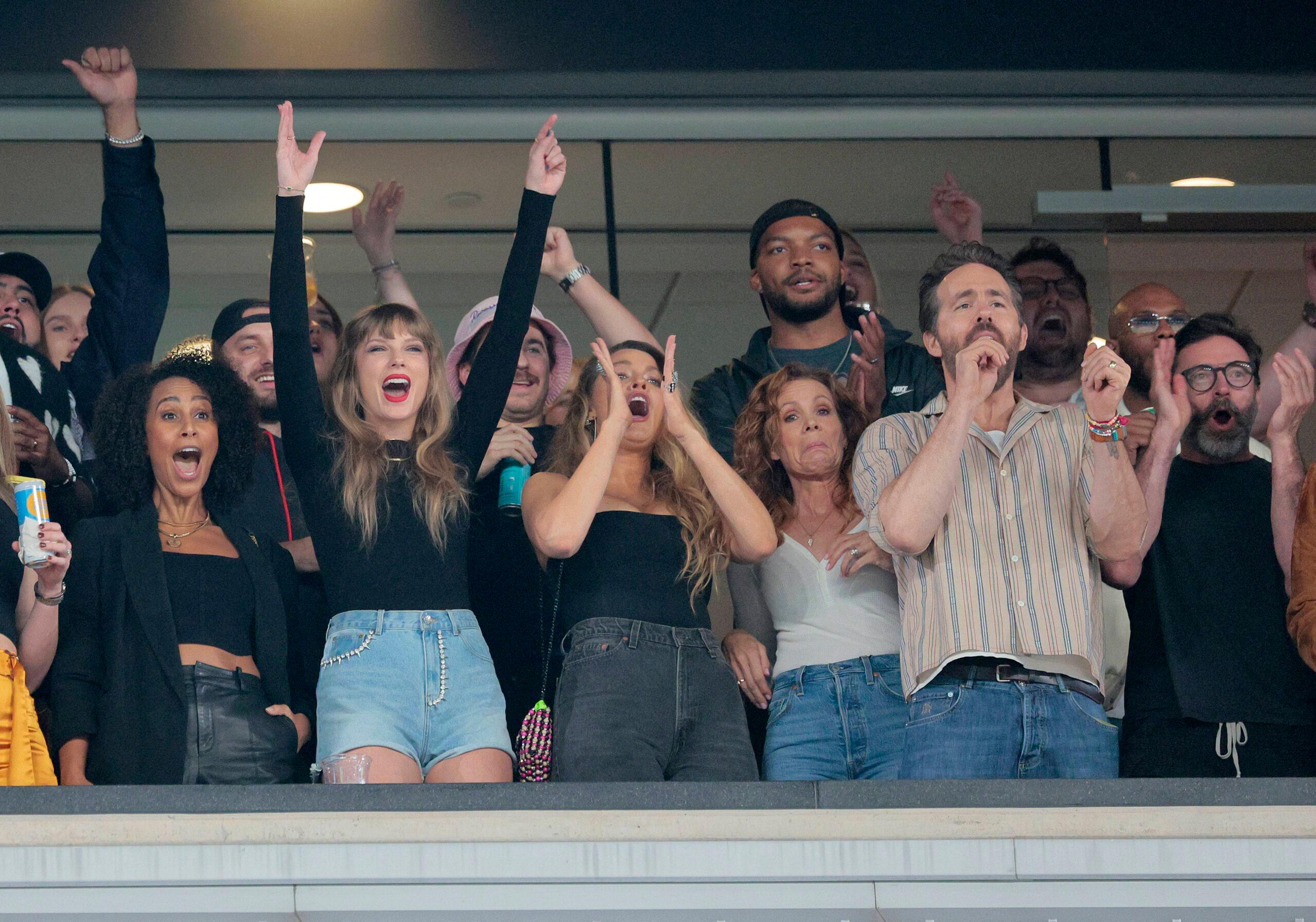 Singer Taylor Swift along with Actors Blake Lively, Ryan Reynolds, and Hugh Jackman at Jets Chiefs game