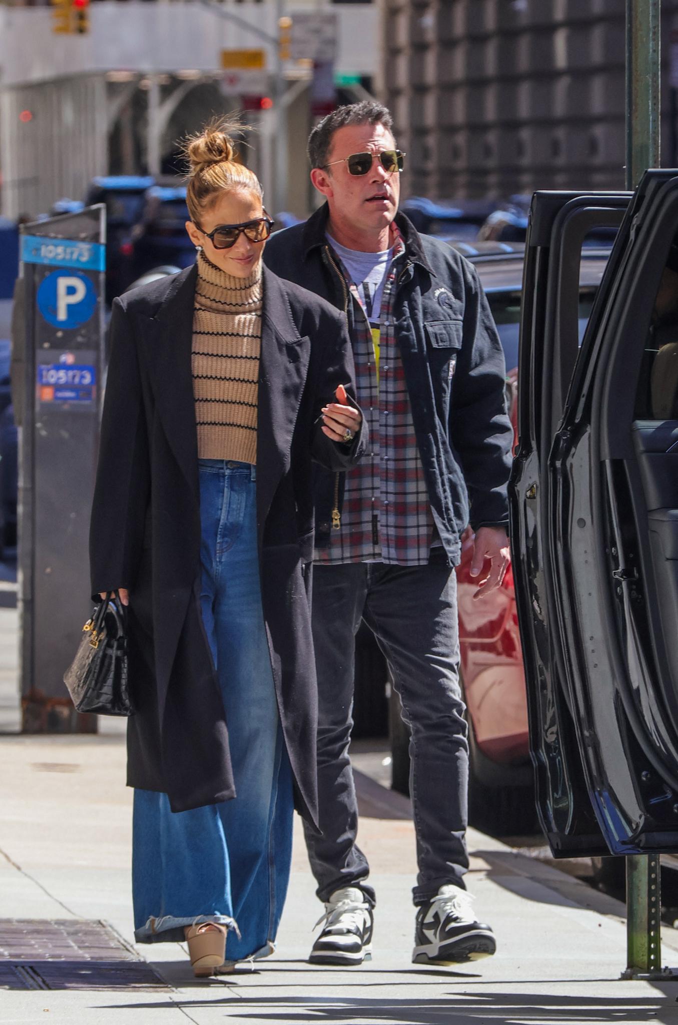 Jennifer Lopez and Ben Affleck step out of their apartment this afternoon in New York City