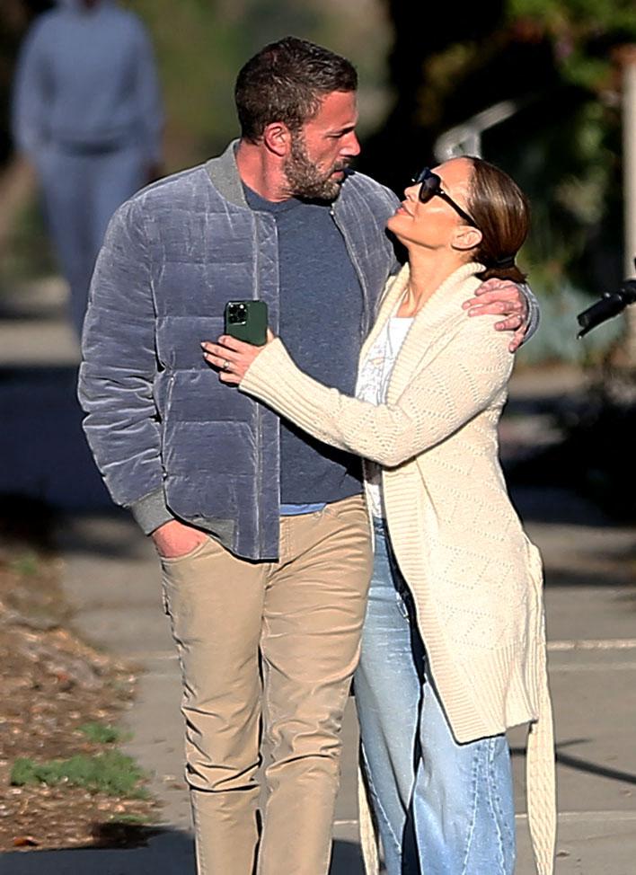 Ben Affleck and Jennifer Lopez share a kiss while out for a morning walk