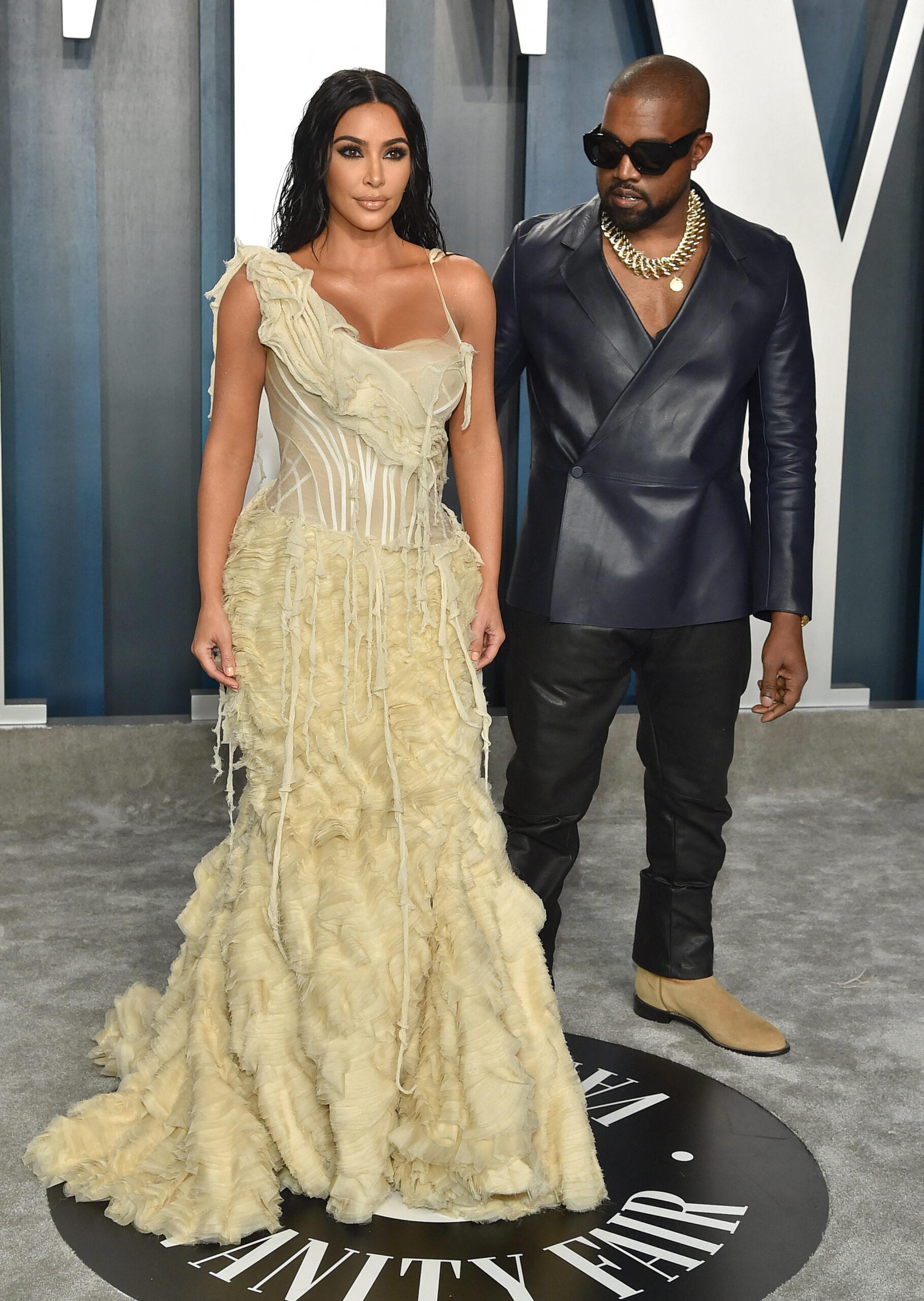 Kanye West and Kim Kardashian posing