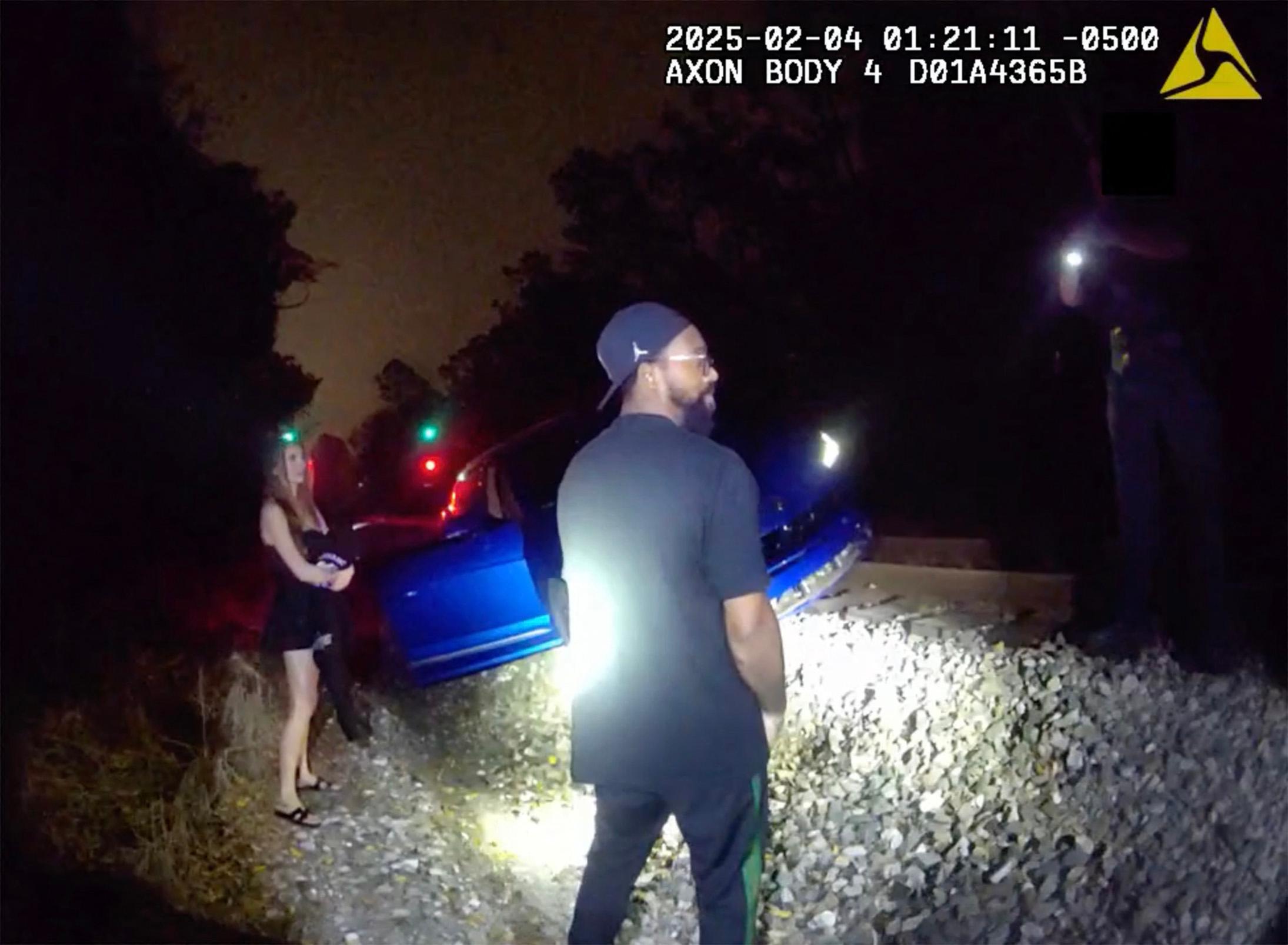 Police bodycam shows Marcus Jordan's DUI arrest after getting Lamborghini stranded on train tracks with his busty brunette passenger.