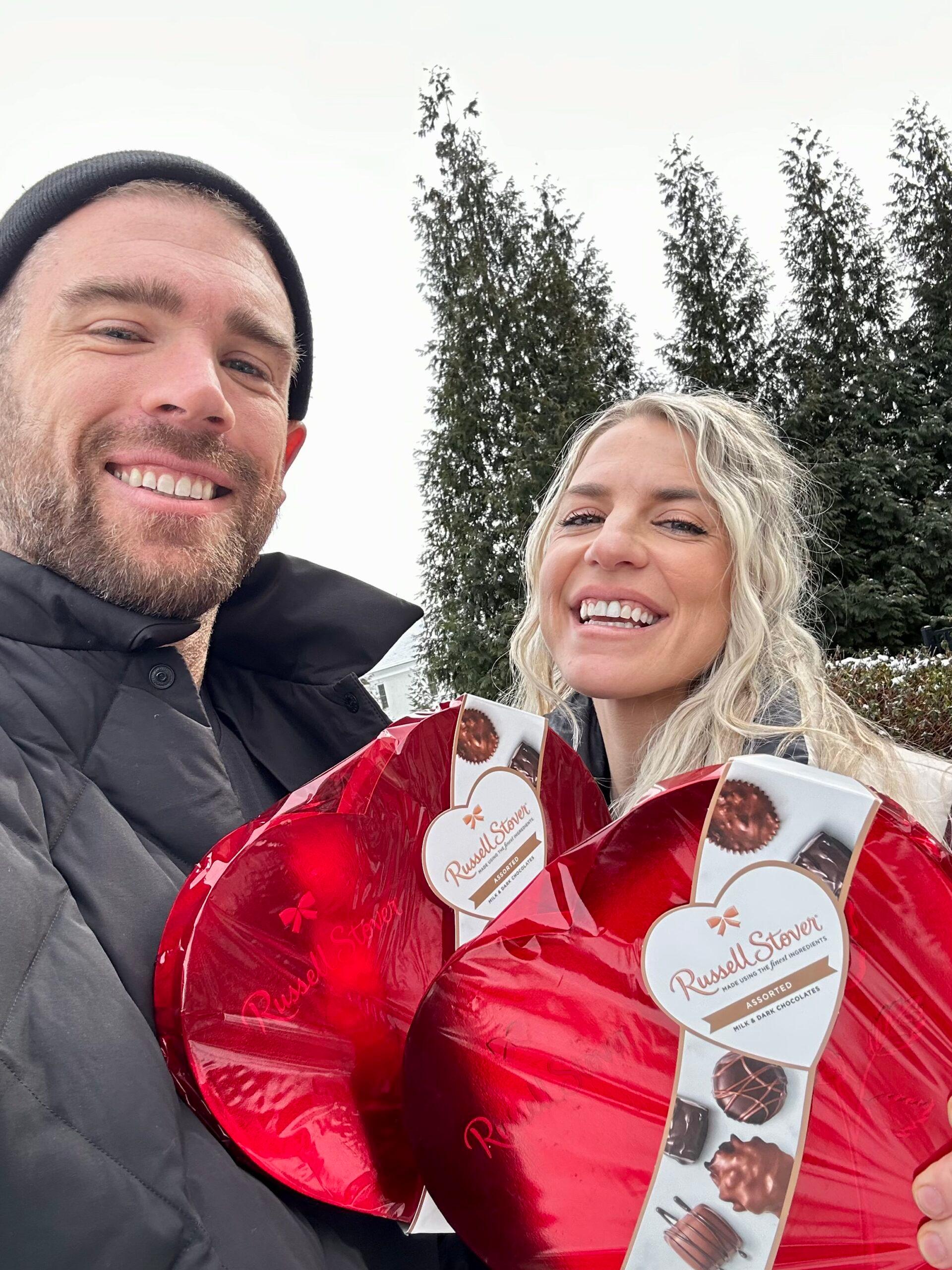 Zach and Julie Ertz with Russell Stover chocolate box