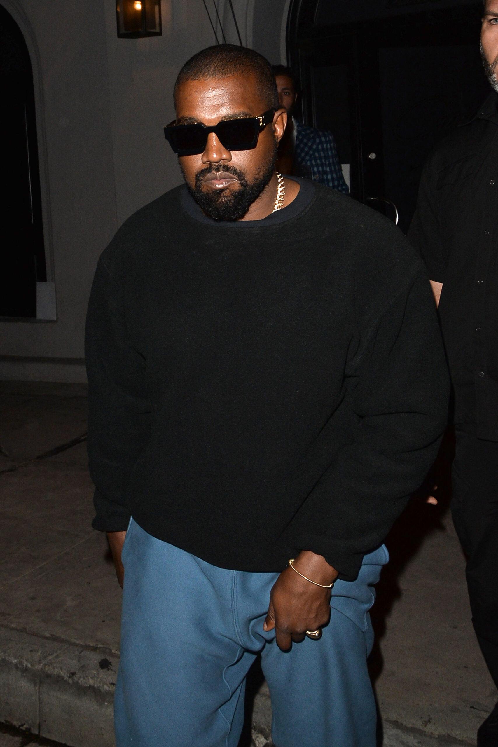 Kanye West wearing black sweatshirt