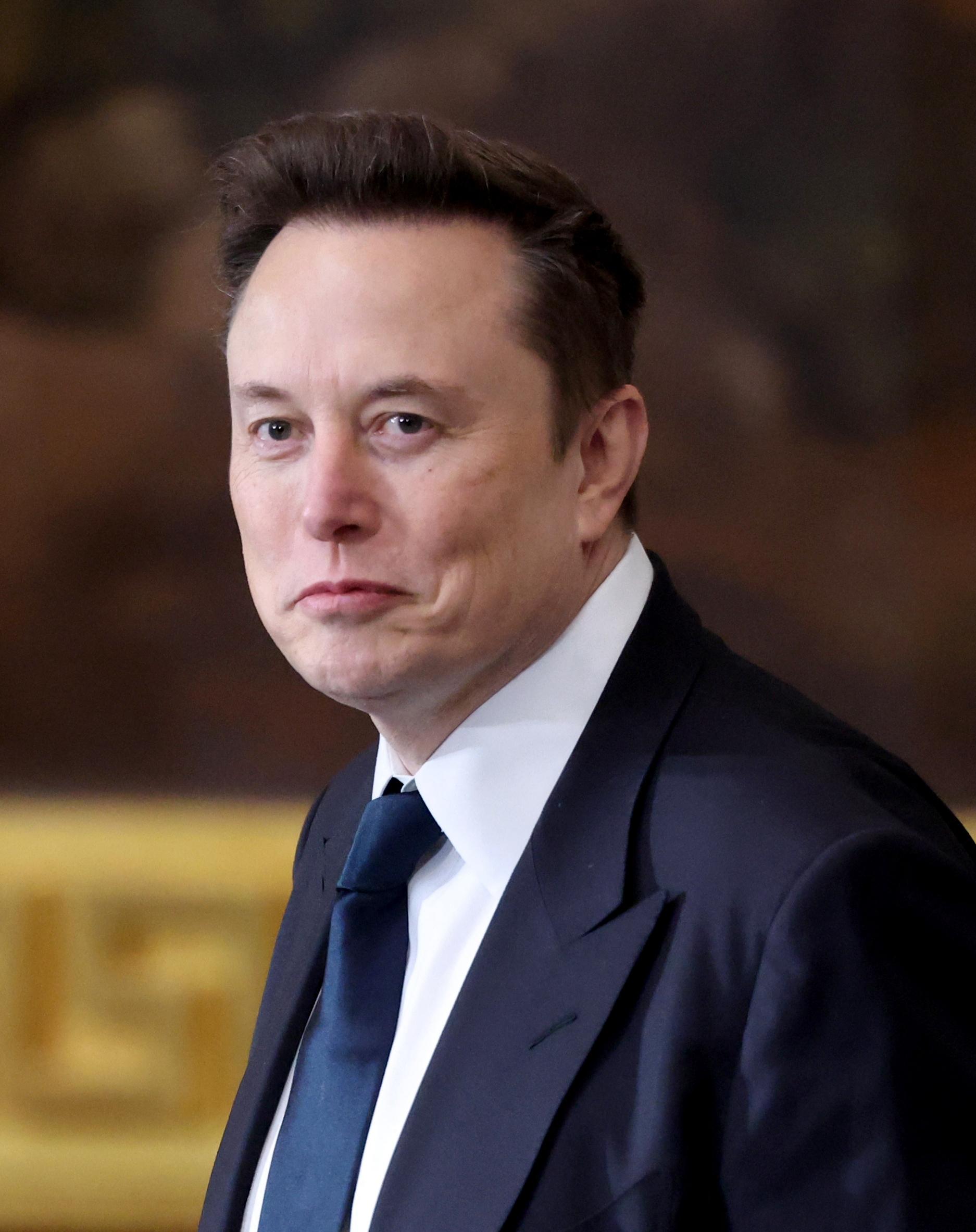 Elon Musk in a suit