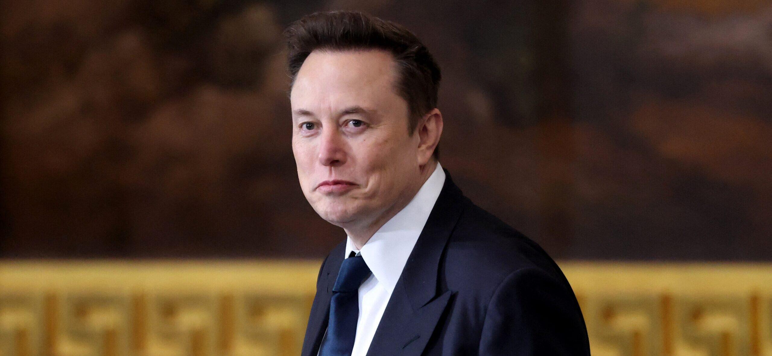 Elon Musk in a suit