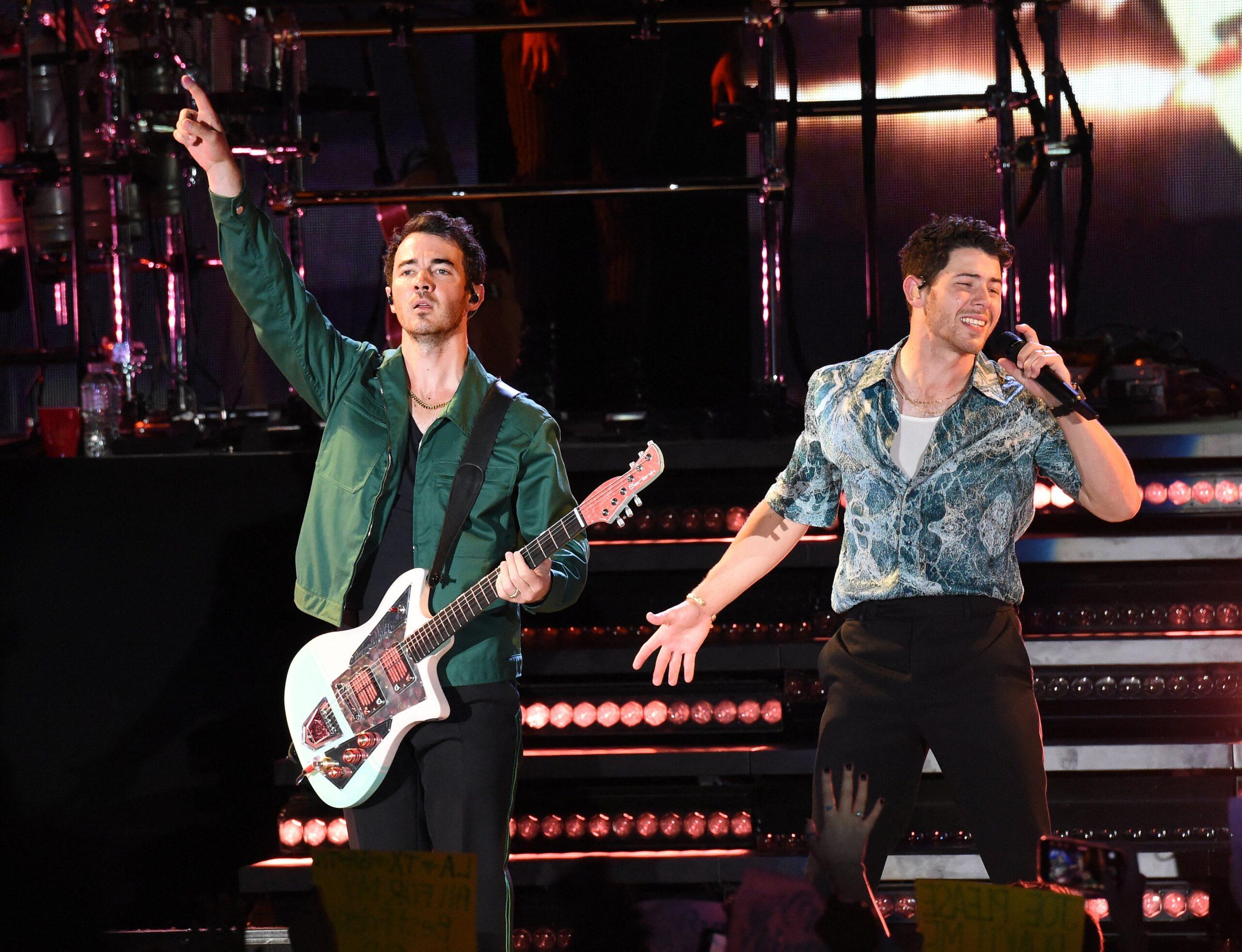 Nick Jonas and Kevin Jonas on stage