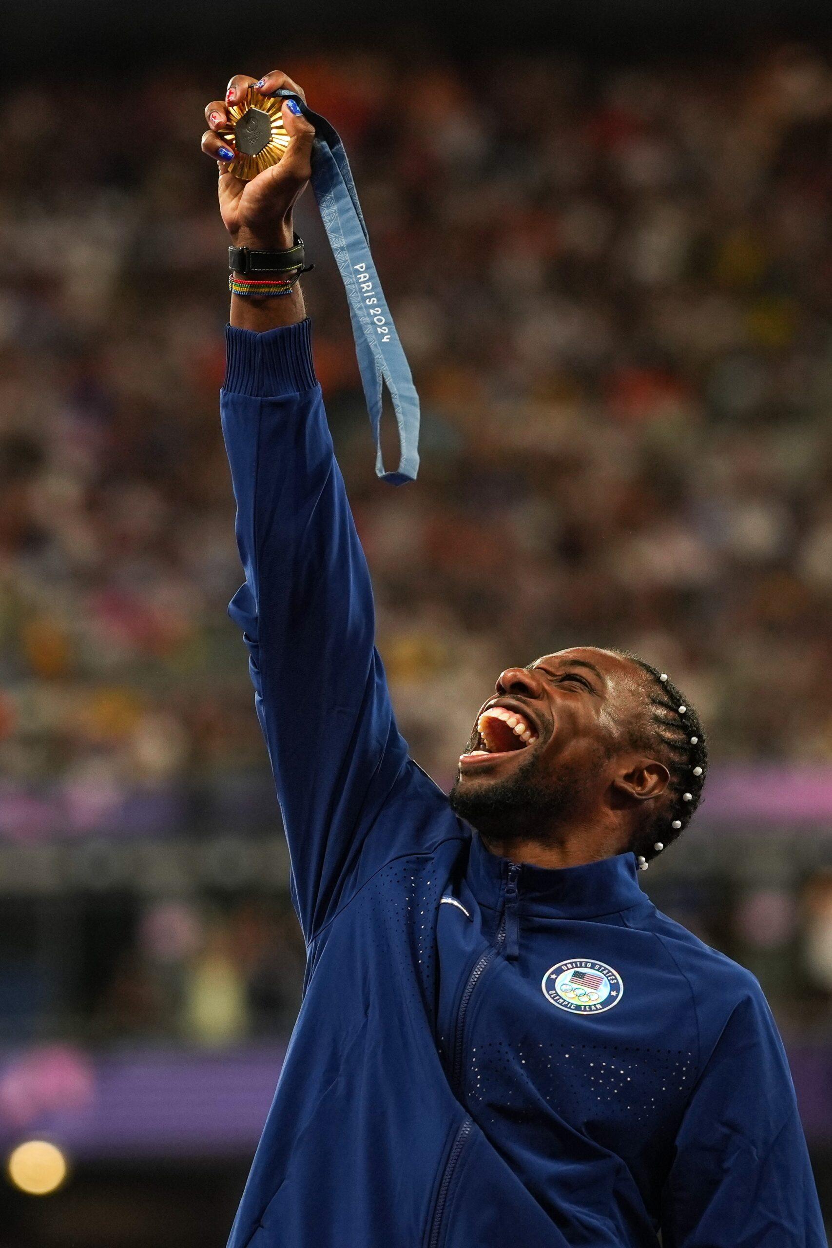 Noah Lyles holding his medal during the 2024 Olympic games.