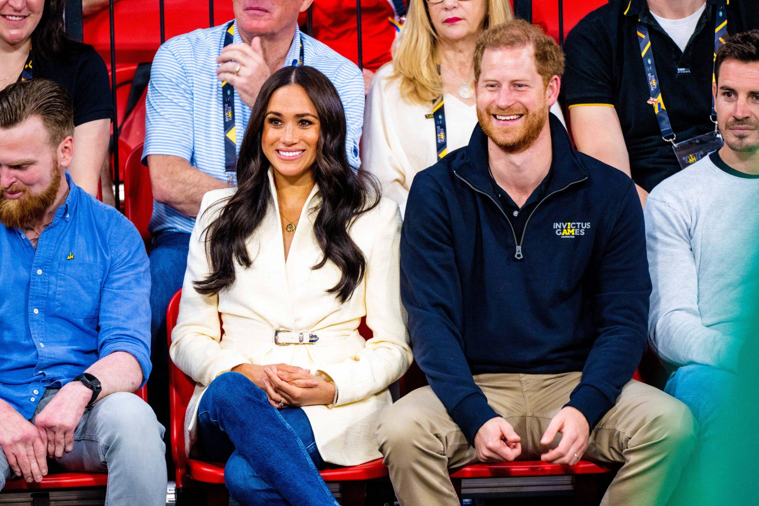 Prince Harry and Meghan Markle sitting together