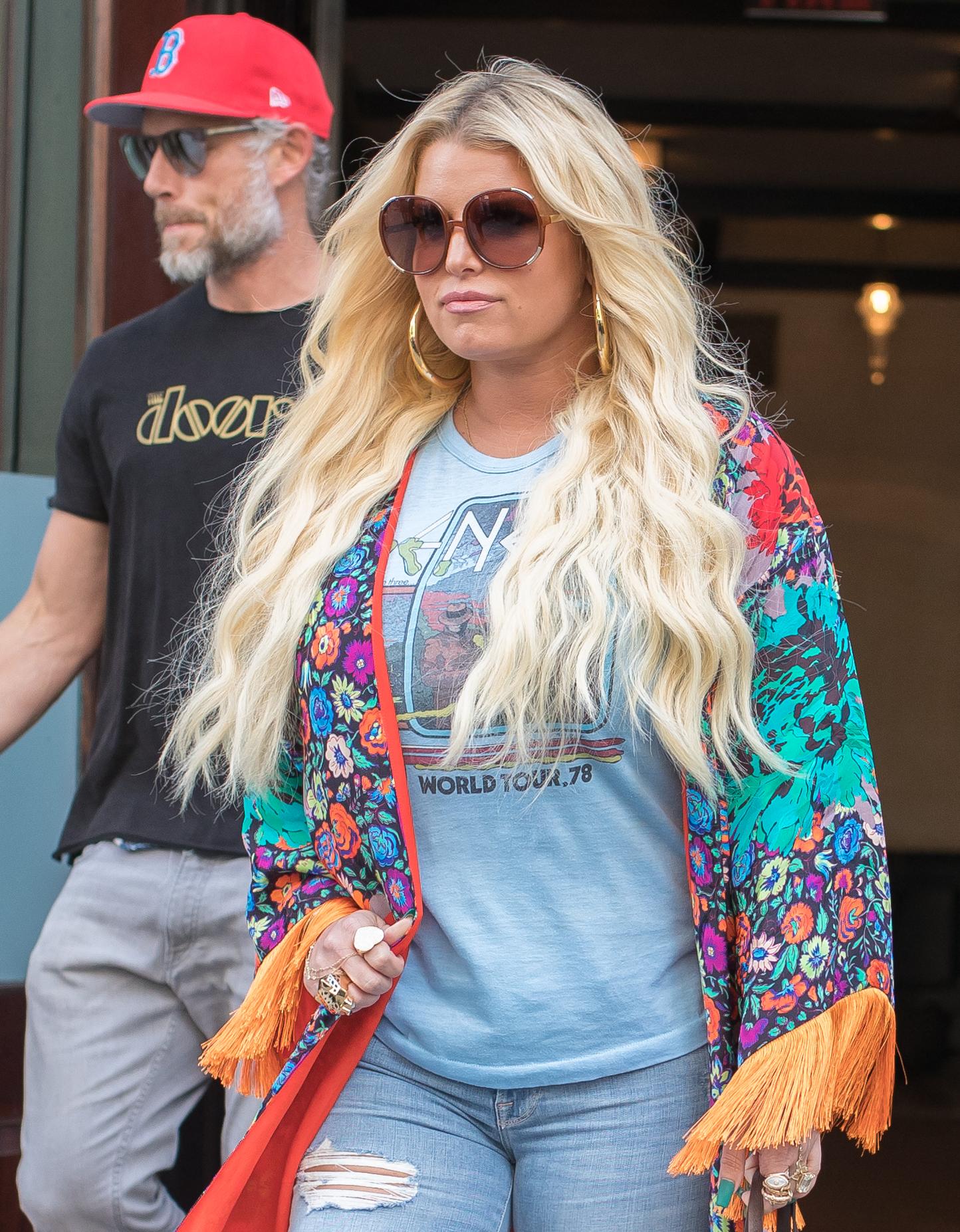 Jessica Simpson walking with Eric Johnson