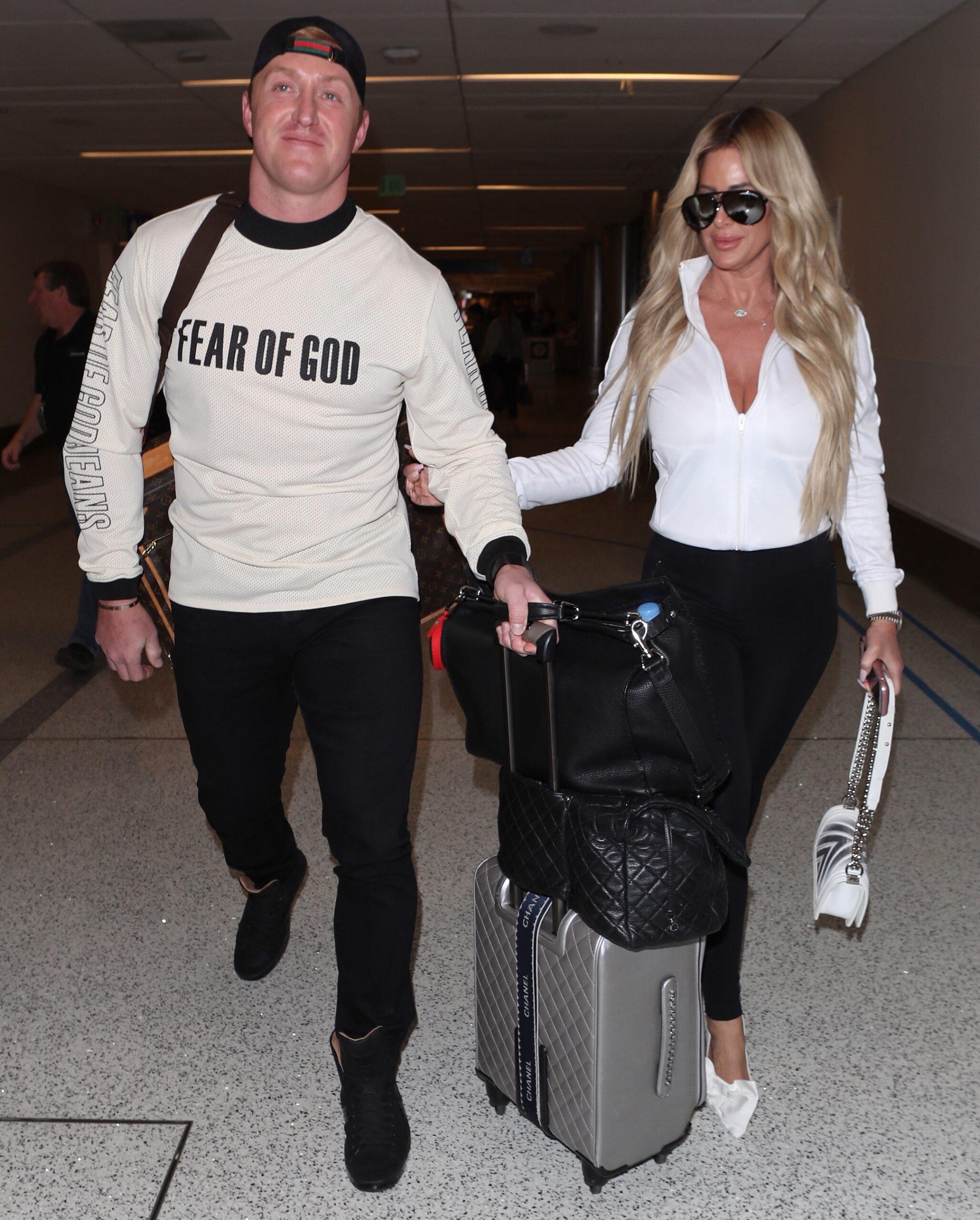 Kim Zolciak makes a sexy arrival as she is spotted at LAX with husband Kroy