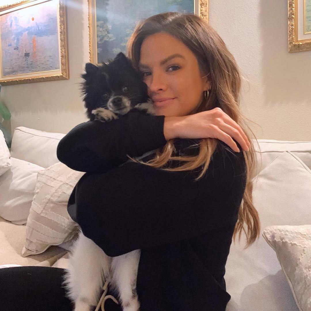 Becca Tilley hugging her dog