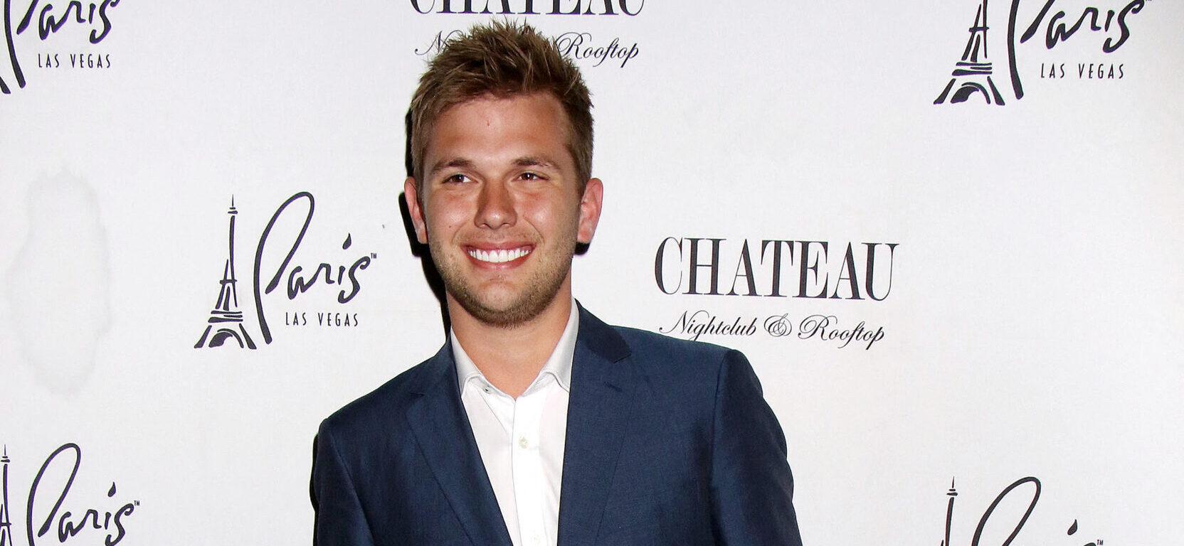 Chase Chrisley posing on the red carpet.