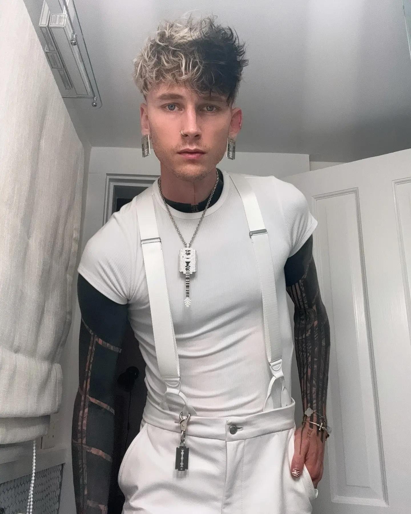 Machine Gun Kelly wearing a white outfit