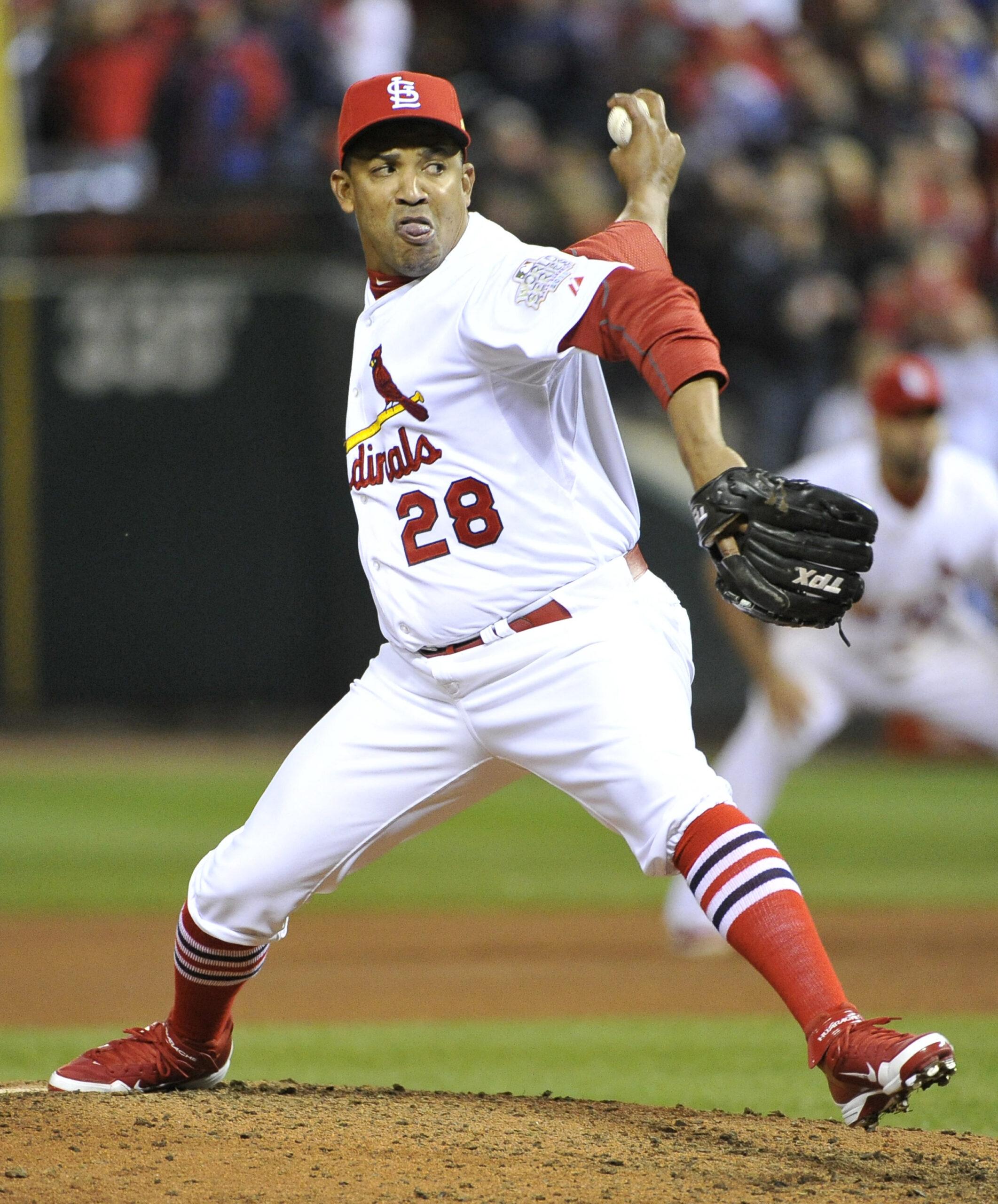 St. Louis Cardinals Octavio Dotel (28) pitches in relief in the seventh inning against the Texas Rangers in game 7 of the World Series at Busch Stadium on October 28, 2011 in St. Louis.