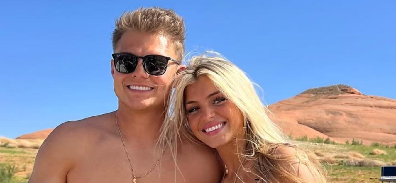 Zach Wilson and Nicolette Dellano smile for the camera.