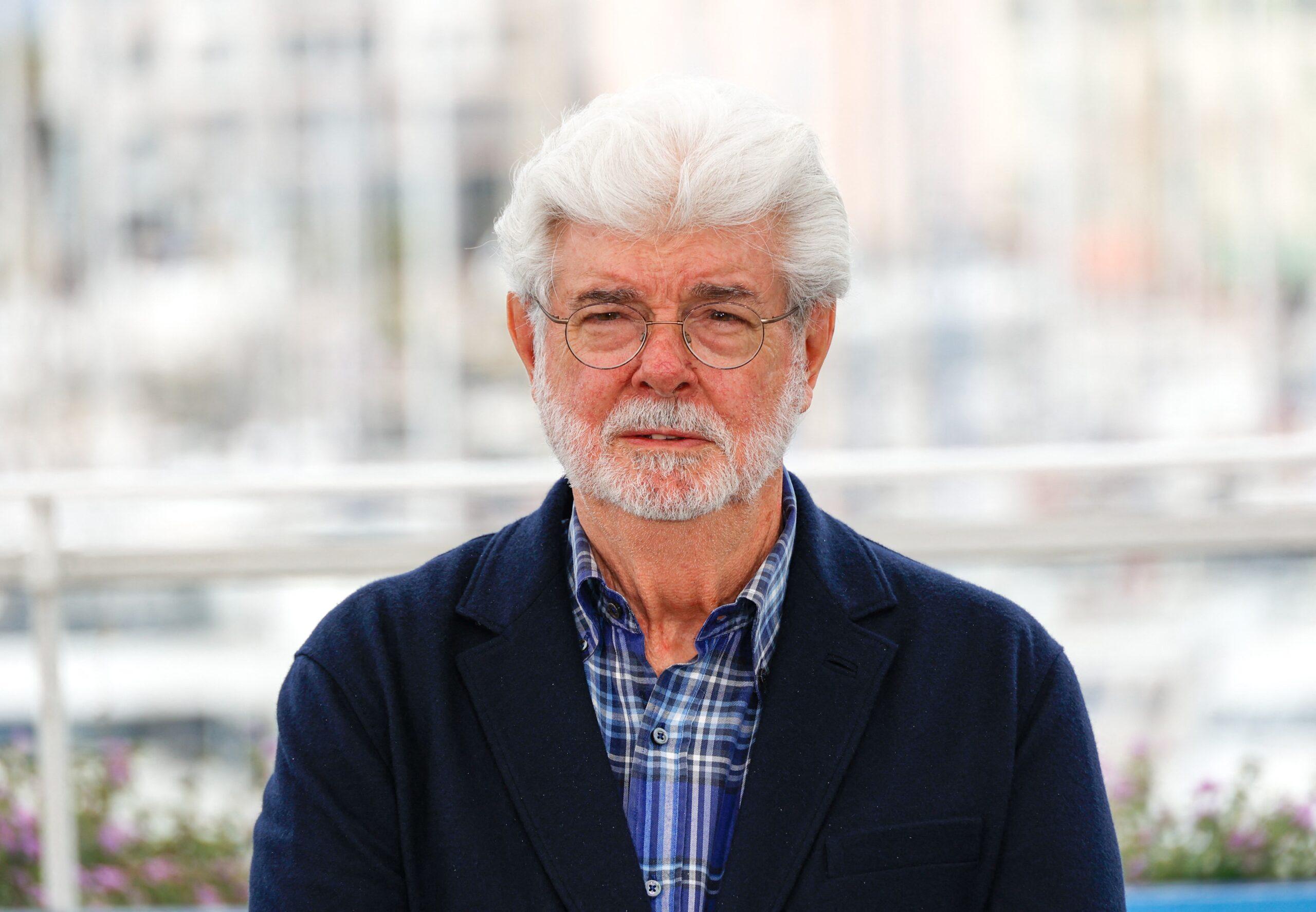 George Lucas attends a photocall as he is awarded the Palm D'Or D'Honneur at the 77th annual Cannes Film Festival