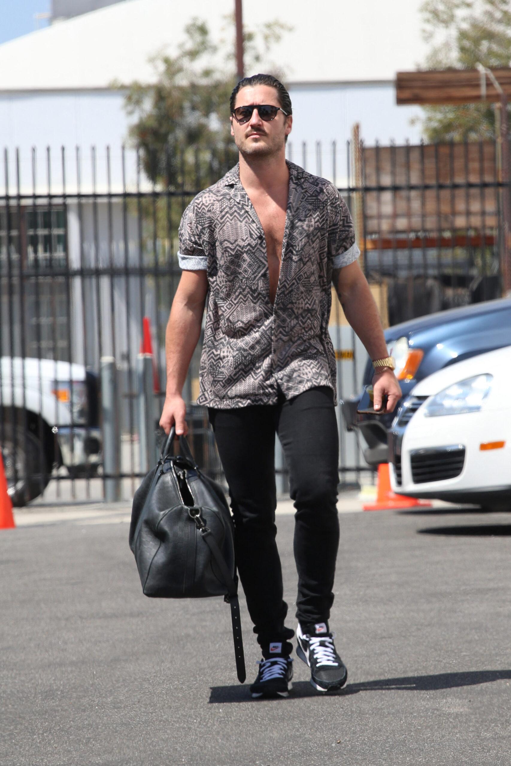 Val Chmerkovskiy swaggers into dance practice