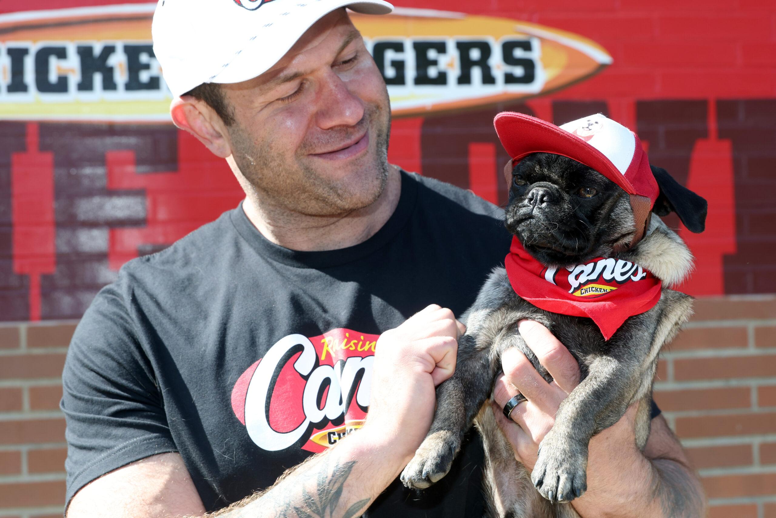 TikTok Animal Welfare Activist Lee Asher Accepts $100,000 Check from Raising Cane's for The Asher House Nonprofit