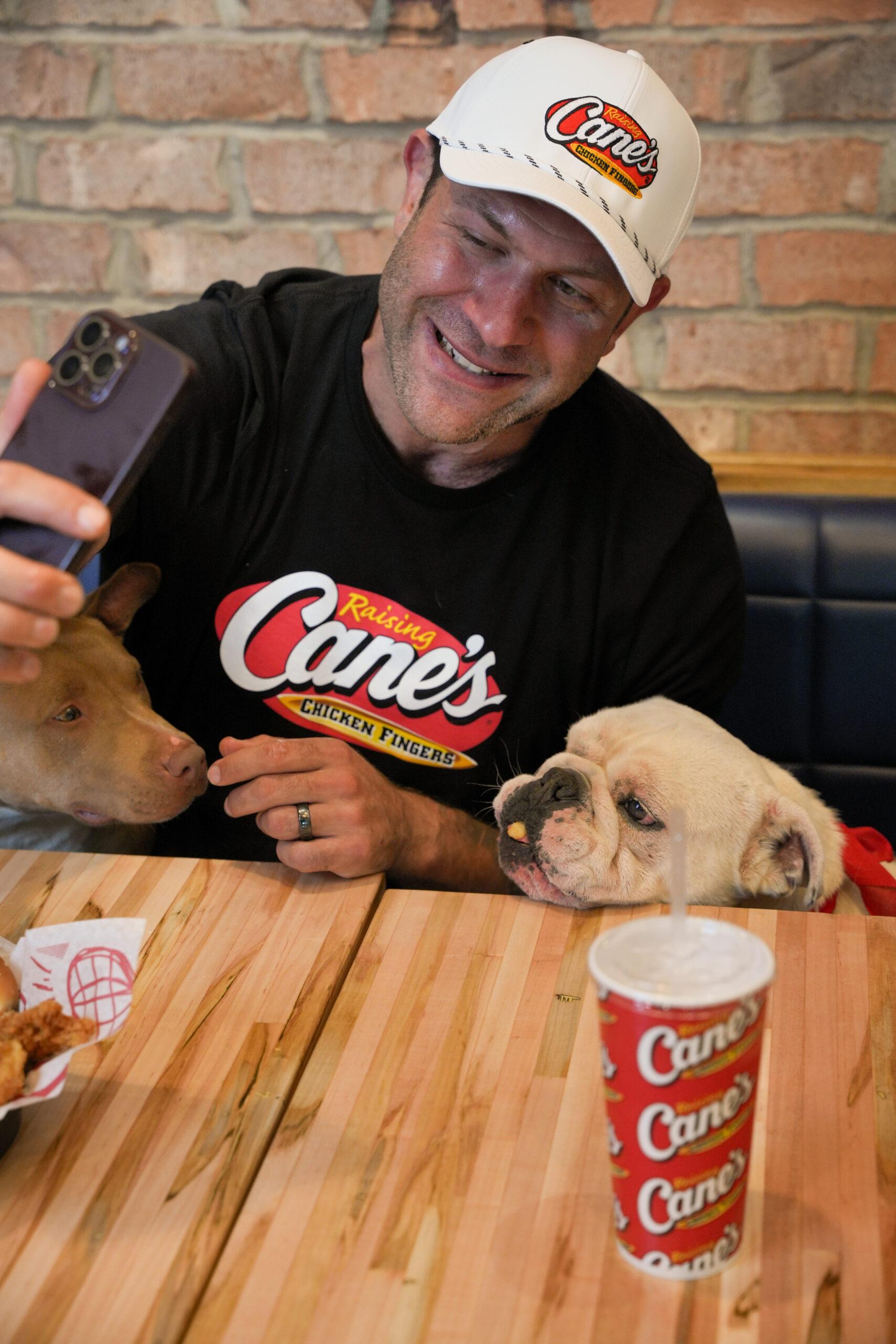 TikTok Animal Welfare Activist Lee Asher Accepts $100,000 Check from Raising Cane's for The Asher House Nonprofit