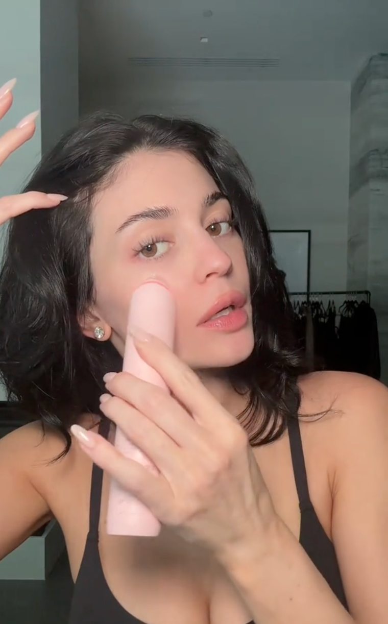 Kylie Jenner applying make up