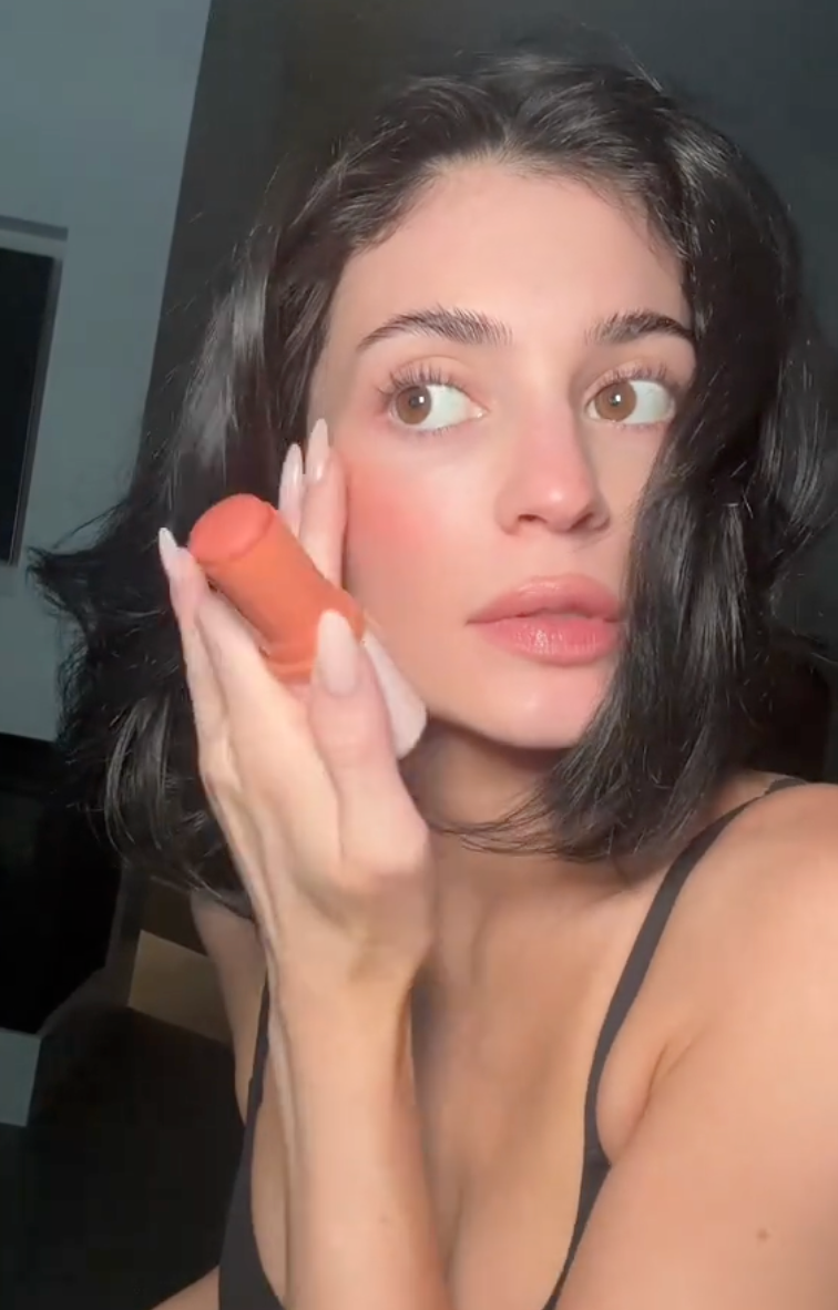 Kylie Jenner applying make up